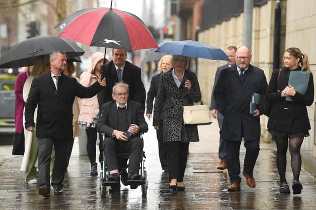 Kingsmill Massacre survivor Alan Black (front) and Karen Armstrong (centre), the sister of victim John McConville, with friends and supporters of the victims arriving at Laganside Courts, Belfast, for an inquest hearing into the Kingsmill massacre, in which 10 Protestant workers were shot dead in 1976