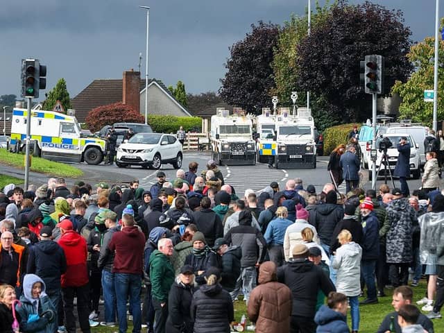 Police monitor protesters continuing to block the Garvaghy Road (Photo by Paul Faith / AFP via Getty Images)