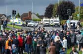 Police monitor protesters continuing to block the Garvaghy Road (Photo by Paul Faith / AFP via Getty Images)