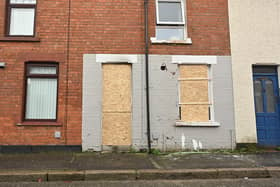 The boarded-up house in Kilburn Street after Saturday's arson attack Pic: Arthur Allison/Pacemaker Press