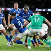 Italy's fly-half Tommaso Allan (C) is tackled during the pre-World Cup Rugby Union friendly match between Ireland and Italy at the Aviva Stadium in Dublin