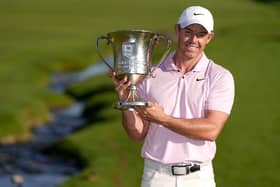 Rory McIlroy holds the trophy after winning the Wells Fargo Championship golf tournament at the Quail Hollow Club on Sunday