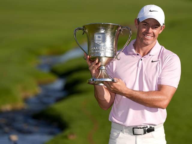 Rory McIlroy holds the trophy after winning the Wells Fargo Championship golf tournament at the Quail Hollow Club on Sunday