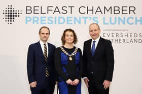 Belfast Chamber president has told an audience of 450 business leaders at the organisation’s President’s Lunch that a restored Executive is essential for NI’s future economic success. Pictured are Matthew Howse, partner, Eversheds Sutherland, Alana Coyle, president, Belfast Chamber and Tánaiste Micheál Martin