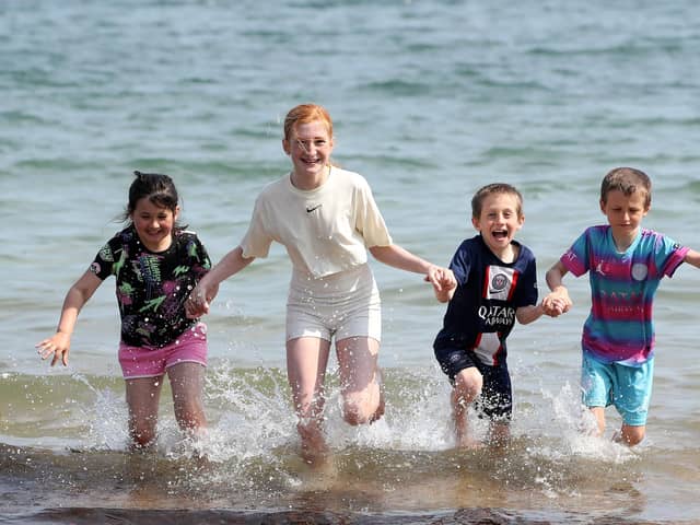 Press Eye - Northern Ireland - 11th May 2024Helens Bay - Weather Pictures(L-R) Charlotte, Ashleigh  Brodie and Jack Elliott Photograph by Declan Roughan / Press Eye