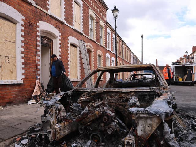 Burned out cars and boarded up houses on McMaster Street in east Belfast after violence erupted on Tuesday night on the streets following a stabbing attack in the Kinnaird Avenue residential area close to the busy Antrim Road in the city, leaving the victim with serious eye, face and back wounds