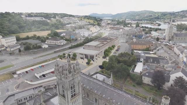 Image of Newry Cathedral and artist's impression of the new NMDDC Civic Centre. (Image from NMDDC website).