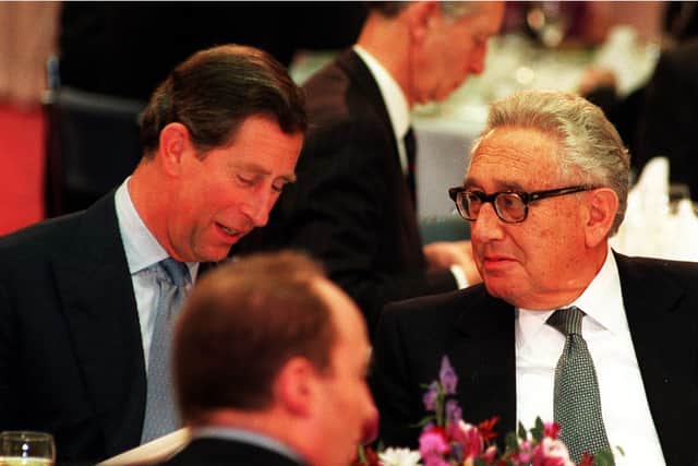 The then Prince of Wales talks with former American secretary of state Dr Henry Kissinger during the Britain In The World conference at the Royal Institute of International Affairs in London. Kissinger, the US secretary of state who dominated foreign policy under former presidents Richard Nixon and Gerald Ford, has died aged 100, his consulting firm Kissinger Associates said