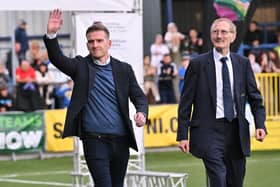 Northern Ireland international Steven Davis waves to the crowd as he opens this year's SuperCupNI tournament