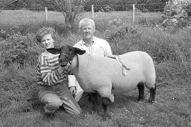 Pictured at the end of May 1992 at the Newry Show is Campbell Watson from Rasharkin and his daughter Deborah, with the Suffolk Champion at the show. Picture: Farming Life archives/Darryl Armitage