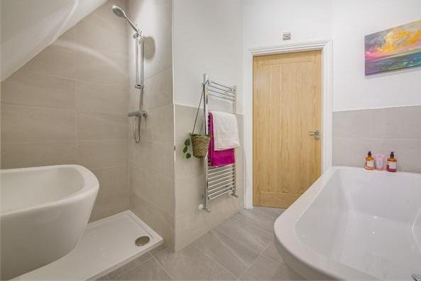 Like the rest of the property, the family bathroom oozes style. Bath, shower, heated towel-rail.....