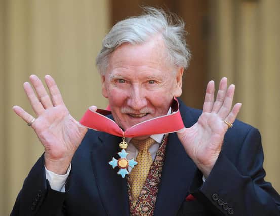 Leslie Phillips poses for photographs after receiving his Commander of the British Empire (CBE) from Britain's Queen Elizabeth II at Buckingham Palace in London, on May 7, 2008. The actor has died aged 98