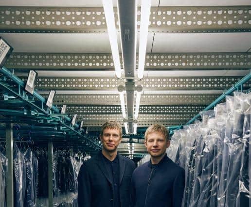 Douglas & Grahame, a family-owned men’s fashion house based in Carrickfergus is marking its first 100 years in business. Chaired by Donald Finlay and now led by sons Adam and Michael Finlay, the company which employs 124, is aiming to achieve its target of £50m turnover in the next five years. Pictured are Michael and Adam Finlay