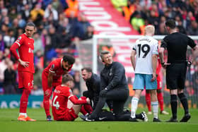 Liverpool's Conor Bradley receives treatment for an injury during the Premier League match at Anfield, Liverpool. PIC: Peter Byrne/PA Wire