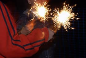 Children playing with sparklers as The Fire and Rescue Service has urged the public to be aware of additional risks during Halloween celebrations.