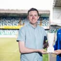 NIFWA Chairman Michael Clarke presents Institute's Michael Harris with his Championship Player of the Month award