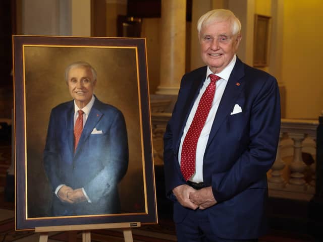 Stena Line owner and chairman, Dan Sten Olsson, stands alongside a specially commissioned portrait that Belfast Harbour has unveiled to celebrate the significant contribution the Swedish ferry operator has made to the Port and Region over the last three decades