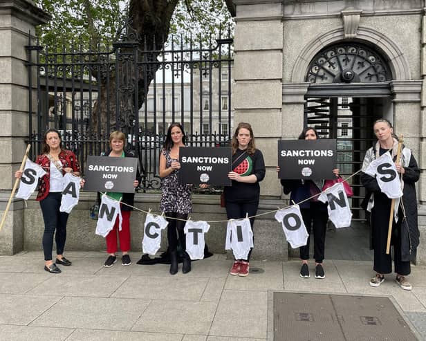 Protesters outside Leinster House in Dublin, after they interrupted, parliamentary statements on recognising Palestine to call for sanctions to be imposed on Israel. The group of demonstrators, who were sitting in the public gallery, got to their feet and chanted pro-Palestinian messages