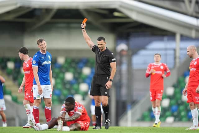 Linfield's Ben Hall is shown a red card by referee Andrew Madley during the Champions League exit to Shelbourne at Windsor Park. (Photo by Niall Carson/PA Wire)