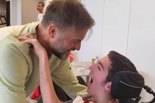 Liam McCallum and Jurgen Klopp embrace as the teenager met his Liverpool heroes thanks to the Make-A-Wish Foundation