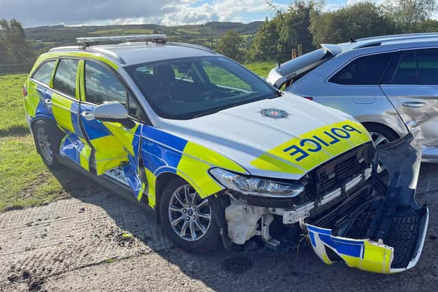 Handout photo issued by PSNI of two damaged police vehicles that were involved in an incident with a tractor. Issue date: Saturday September 24, 2022.