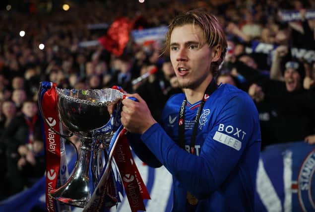 Rangers’ Todd Cantwell celebrating on Sunday with the Viaplay Cup trophy after victory over Aberdeen at Hampden Park. (Photo by Ian MacNicol/Getty Images)