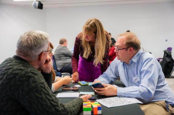 Participants playing a Business Simulation focusing on collaboration