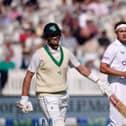 England's Stuart Broad celebrates taking the wicket of Ireland’s Mark Adair (foreground) during day one of the first LV= Insurance Test match at Lord's