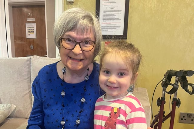 Resident from Oakmont Lodge Care Home enjoys the chat with a Red Brick House Nursery School pupil