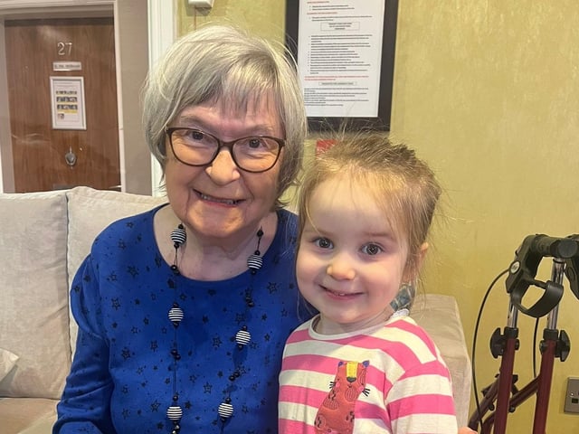 Resident from Oakmont Lodge Care Home enjoys the chat with a Red Brick House Nursery School pupil