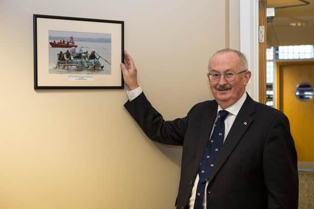 Fundraising Photographer of the Year 2013 Colin Watson being awarded at RNLI HQ in Poole.