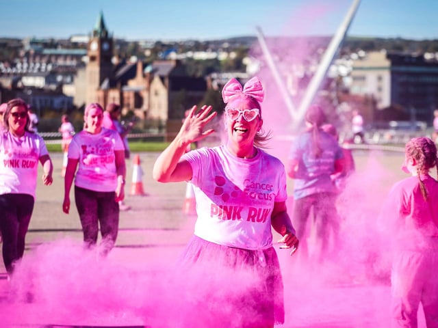 Runners, walkers, and pooches were splashed in pink powder from head to toe for a great cause as Cancer Focus NI’s first Pink Run took place in Londonderry. Picture Steven McAuley/McAuley Multimedia