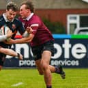 Banbridge’s Ben Johnston tackled by Chris Balfour against Enniskillen. (Photo by Andrew McCarroll/Pacemaker Press)