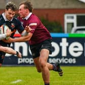 Banbridge’s Ben Johnston tackled by Chris Balfour against Enniskillen. (Photo by Andrew McCarroll/Pacemaker Press)