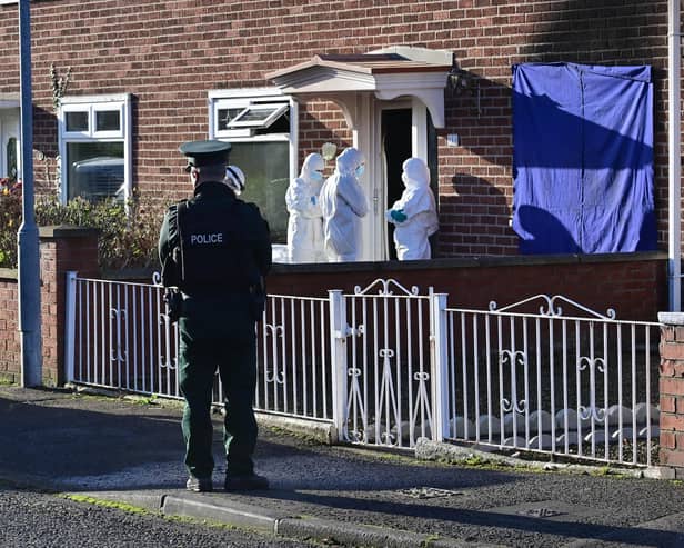 Forensics  at the scene after a person died after a fire at a house in east Belfast.