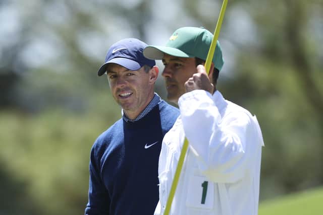 Rory McIlroy (left) and his caddie, Harry Diamond, on the eighth hole of the Masters first round at Augusta. (Photo by Andrew Redington/Getty Images)
