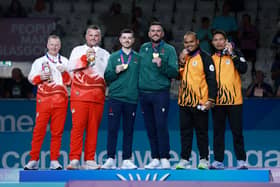Adam McKeown (third left) and Gary Kelly (third right) top of the podium for Team NI alongside, from left, England's Nick Brett and Jamie Walker then Malaysia's Amirul Danial Abdul Rahim and Mohammad Soufi Rusli. (Photo by Adam Pretty/Getty Images)