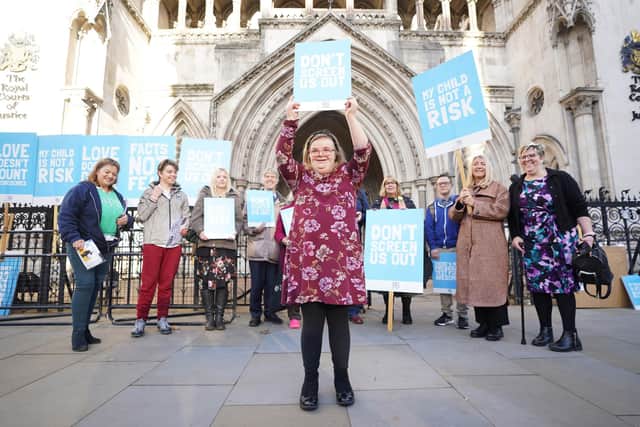 Supporters of Heidi Crowter outside the Royal Courts of Justice in central London as the Court of Appeal releases its judgement relating to the legislation which allows the abortion of babies with Down's Syndrome up until birth.