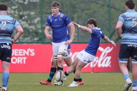 Queen's Ben McFarlane (pictured) converted a Josh Stevens try in the 33-14 win over Trinity at the Dub. (Photo by David Maginnis/Pacemaker Press)