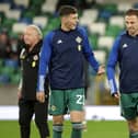 Northern Ireland's Eoin Toal (left) will have another chance to add to his international caps in the absence of injured Manchester United defender Jonny Evans (right)