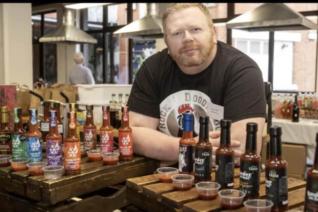 Rock fan Dave Kernaghan of Rock a Doodle Hot Sauces in Helens Bay pictured with his range of spicy sauces