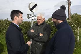 DUP MLA Jonathan Buckley, Nigel Dawson, the district master of the Orange Order in Portadown, and deputy district master Alastair Power, talk near Drumcree Church in Portadown, Co Armagh. Photo: Mark Marlow/PA Wire
