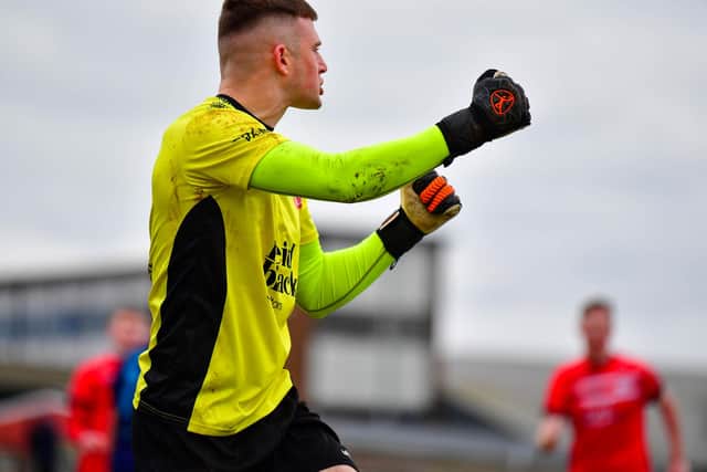 Ballyclare Comrades goalkeeper Declan Breen celebrates saving a penalty against Ballymena United during their Irish Cup match at Dixon Park, Ballyclare. PIC: Andrew McCarroll/ Pacemaker Press