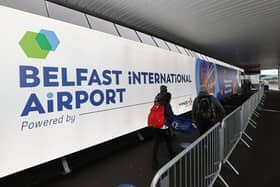 Travellers arriving at Belfast International Airport for their flights.