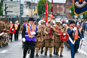 Marchers in WWI-era military uniform formed part of the parade (Andrew McCarroll/ Pacemaker Press)