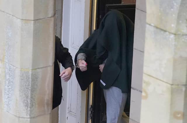 Andrew Miller (covered) being led from Selkirk Sheriff Court after he admitted abducting a primary school aged girl while dressed as a woman before sexually assaulting her repeatedly over more than 24 hours.