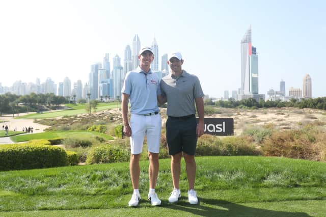 Rory McIlroy with fellow Northern Ireland man Tom McKibbin on the 8th tee during a practice at the Hero Dubai Desert Classic at Emirates Golf Club. (Photo by Oisin Keniry/Getty Images)