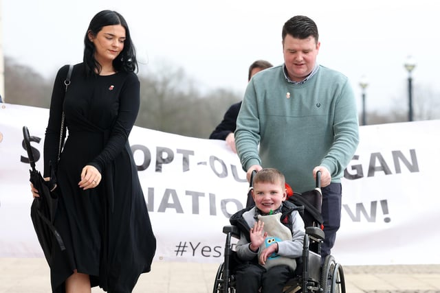 Dáithí Mac Gabhann and his parents Mairtin and Seph arrive at Stormont, east Belfast. Stormont assembly recalled for the sixth time since its collapse last year.