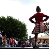 A Scottish Highland dancer - Newry, Mourne and Down Council is to review its Ulster Scots policy.