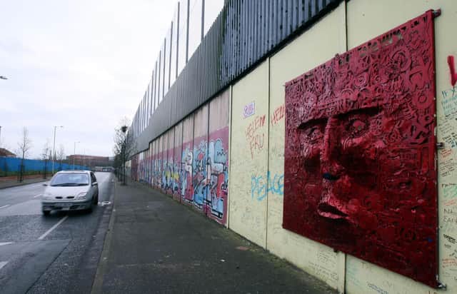 A peace wall in west Belfast – most young people surveyed say they live in segregated areas
